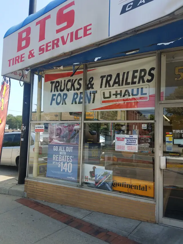 A weathered, close-cropped view of the BTS Tire and Service storefront from an earlier era, with dated red and white lettering